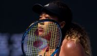 Naomi Osaka of Japan waits during her women's singles quarter finals match against Zhang Shuai of China at the China Open tennis tournament in Beijing on October 5, 2018. / AFP / NICOLAS ASFOURI