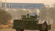 FILE PHOTO : A rebel fighter rides a military vehicle in Dahiyat al-Assad, west Aleppo city, Syria October 28, 2016. REUTERS/Ammar Abdullah
