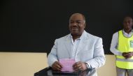 Gabon's President Ali Bongo casts his ballot at a polling station in Libreville during the first round of the country's legislative and municipal elections on October 6, 2018.  AFP / Joel TATOU