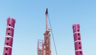 Engineers and technicians working on the Gulf Laboratories Co’s new jack-up drilling platform—Ammonite.