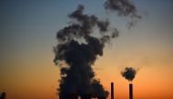 This file photograph shows smoke rising from the 
