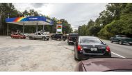People line up for gasoline as Hurricane Michael bears down on the northern Gulf coast of Florida on October 8, 2018 outside Tallahassee, Florida.  Mark Wallheiser/Getty Images/AFP