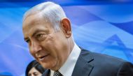 TV screen shows Israeli Prime Minister Benjamin Netanyahu delivering a speech after the US President announced his decision to withdraw from the Iranian nuclear deal on May 8, 2018. AFP/Thomas Coex