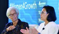 International Monetary Fund chief Christine Lagarde (L) listens as Indonesian Finance Minister Sri Mulyani Indrawati speaks during a forum entitled 