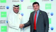 Hassan Al Efrangi (left), Deputy CEO, Retail and Private Banking, Ahlibank, and Wael El Aawar, Vice-President of Sales, NCR Banking, shaking hands after signing the agreement. 
