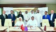 QBA and MUSIAD officials signing the MoU.