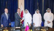 Sharaka Holdings Chairman Sheikh Abdulla bin Ahmed Al Thani (third left) and Alex Kyriakidis, President and Managing Director, Middle East and Africa, Marriott International, shaking hands after the agreement signing ceremony, yesterday.