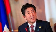  Japan's Prime Minister Shinzo Abe delivers a speech during a joint press announcement for the 10th Mekong-Japan Summit at the Akasaka Palace state guest house in Tokyo on October 9, 2018. / AFP / POOL / FRANCK ROBICHON