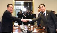 South Korean Unification Minister Cho Myoung-gyon (R) shakes hands with his North Korean counterpart Ri Son Gwon (L) during their meeting at the southern side of the border truce village of Panmunjom in the Demilitarized Zone (DMZ) dividing the two Koreas
