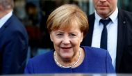 German Chancellor Angela Merkel leaves an event of the Federation of German Wholesalers and Retailers (BGA) in Berlin, Germany, October 15, 2018. REUTERS/Fabrizio Bensch