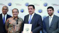 Mohamad Ismail Mandani Al Emadi (second right), Commercial Bank Board Member; Commercial Bank Group Chief Executive Officer Joseph Abraham (second left); Parvez Khan - EGM, Treasury & Investment (left); and Fahad Badar, EGM, International Banking during t