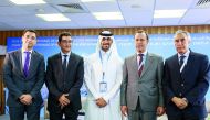 QREC Head of Show Section Hassan Al Mannai (centre) along with other officials pose for a group photo, yesterday. 
