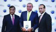 QIB Group CEO Bassel Gamal (centre) with officials during the awards ceremony held in Bali, Indonesia.