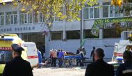 Rescuers carry an injured victim of a blast at at a college in the city of Kerch on October 17, 2018. (AFP / KERCH.FM)
