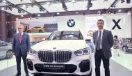 Rabih Ataya, General Manager of Alfardan Automobiles, and Ayser Maan, Area Sales Manager at BMW Group Middle East, during the lauch at Qatar Motor Show 2018 held at the DECC yesterday.