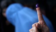 A voter shows an inked finger after casting vote at a polling station during the parliamentary elections in Herat, Afghanistan on October 20, 2018. Mir Ahmad Firooz - Anadolu Agency 