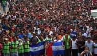 Honduran migrants heading in a caravan to the US, hold a demonstration demanding authorities to allow the rest of the group to cross, in Ciudad Hidalgo, Chiapas state, Mexico after crossing from Guatemala, on October 20, 2018. AFP / Pedro Pardo