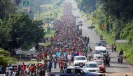 Central American migrants walk along the highway near the border with Guatemala, as they continue their journey trying to reach the U.S., in Tapachula, Mexico October 21, 2018. REUTERS/Ueslei Marcelino