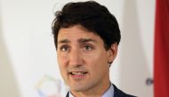 (FILES) In this file photo taken on October 12, 2018 Canada's Prime Minister Justin Trudeau speaks with the media at the end of the 17th Francophone countries summit in Yerevan. AFP / Ludovic MARIN