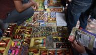 Indian customers visit a firecracker shop in New Delhi on October 23, 2018. / AFP / Money SHARMA 