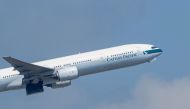A Cathay Pacific passenger jet takes off from Hong Kong International Airport.  AFP / Anthony WALLACE