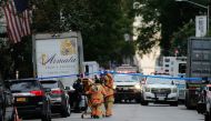 Police and first responders are seen on the scene where suspicious package was found in Midtown Manhattan on October 26, 2018 in New York City. Democratic US Senator Cory Booker is the latest target in a spree of 11 suspicious packages sent to opponents o