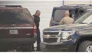 FBI officers escort Cesar Altieri Sayoc into a waiting SUV at FBI headquarters after arresting him in connection with an investigation into a string of parcel bombs in Miramar, Florida, U.S. October 26, 2018. WSVN Ch. 7/Handout via REUTERS 