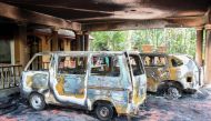 Charred vehicles are pictured at a spiritual retreat after it was set ablaze in Kundamankadavu on the outskirts of Thiruvananthapuram in southern Kerala state on October 27, 2018. AFP 