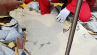 Workers of PT Pertamina examine recovered debris of what is believed from the crashed Lion Air flight JT610, onboard Prabu ship owned by PT Pertamina, off the shore of Karawang regency, West Java province, Indonesia, October 29, 2018. Antara Foto/PT Perta