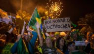  Supporters of far-right presidential candidate Jair Bolsonaro, celebrate in front of his house in Rio de Janeiro, Brazil, after he won Brazil's presidential election, on October 28, 2018. AFP / Mauro Pimentel