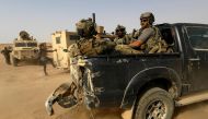 FILE PHOTO: In this file photo taken on September 13, 2018, US-backed forces are pictured near the village of Susah in the eastern province of Deir Ezzor, near the Syrian border with Iraq. AFP / Delil souleiman
