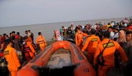 Rescue team members carry the boat heading to the Lion Air, flight JT610, sea crash site off the coast of Karawang regency, West Java province, Indonesia, October 29, 2018. REUTERS/Beawiharta