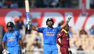 India cricketer Rohit Sharma celebrates after scoring a century (100 runs) during the fourth one day international (ODI) cricket match between India and West Indies at the Brabourne Stadium in Mumbai on October 29, 2018. (AFP / PUNIT PARANJPE)