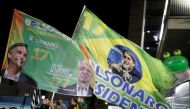 Supporters of Jair Bolsonaro, far-right lawmaker and presidential candidate of the Social Liberal Party (PSL), react after Bolsonaro wins the presidential race, in Sao Paulo, Brazil October 28, 2018. REUTERS/Nacho Doce