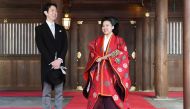 This picture taken on October 29, 2018 shows Japanese Princess Ayako (R) and her husband Kei Moriya answering questions from journalists after their wedding ceremony at the Meiji Shrine in Tokyo. Japan OUT / AFP / JAPAN POOL / JIJI PRESS 