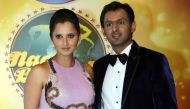 (FILES) In this file photo taken on December 19, 2012 Indian tennis player Sania Mirza (R) and her husband Pakistani cricketer Shoaib Malik pose for a photo during a promotional event in Mumbai. AFP 