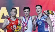 Artur Dalaloyan (centre) gold medal winner in the all-around category at the 48th Artistic Gymnastics World Championships Doha 2018 poses for a picture along with silver medal winner Xiao Ruoteng (left) of China and Nikita Nagornyy of Russia at the Aspire