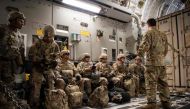 In this image from the US Air Force, Airman 1st Class Trevor Pearce briefs troops aboard a C-17 Globemaster III at Fort Knox, Kentucky, on October 30, 2018, part of the support for Operation Faithful Patriot. AFP PHOTO / US Air Force / Airman 1st Class Zo