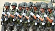 (FILES) This file photo taken on June 22, 2013 shows South Korean soldiers marching during a ceremony for a re-enactment of the battle of Chuncheon at the beginning of the 1950-53 Korean War, in Chuncheon.AFP