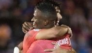 Real Madrid's Spanish midfielder Marco Asensio (L) celebrates with Real Madrid's Brazilian forward Vinicius Junior after scoring a goal during the Spanish King's Cup (Copa del Rey) football match between UD Melilla and Real Madrid CF at the Alvarez Claro 