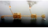 Gas flares from an oil production platform at the Soroush oil fields, south of the capital Tehran, July 25, 2005. (REUTERS/Raheb Homavandi/File Photo)