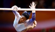 Simone Biles of the United States competes on the uneven bars during day nine of the 2018 FIG Artistic Gymnastics Championships at the Aspire Dome on November 2, 2018 in Doha, Qatar. (AFP / KARIM JAAFAR)