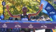Lelisa Desisa of Ethipoia crosses the finish line to win the Men's Division during the 2018 TCS New York City Marathon in New York on November 4, 2018.  AFP / Timothy A. Clary
