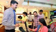 Salesmen pitching different jewellery designs to customers at Kalyan Jewellery. Pics: Salim Matramkot/The Peninsula