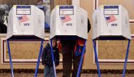 A voter casts his ballot in the midterm election at the East Midwood Jewish Center polling station in the Brooklyn borough of New York City on November 6, 2018. Americans started voting Tuesday in critical midterm elections that mark the first major voter