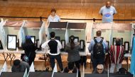 People vote at the Galleria at Sunset mall on November 6, 2018 in Henderson, Nevada. Americans vote on their choices of candidates in this midterm election, which is seen by many as a referendum on President Donald Trump. Ethan Miller/AFP