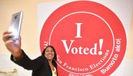 A woman takes a selfie after voting at City Hall in San Francisco on November 6, 2018. AFP/Josh Edelson