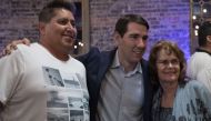 Democratic candidate for California's 10th Congressional District Josh Harder poses for a photo with supporters at an election night event on November 6, 2018 in Modesto, California. Alex Edelman/Getty Images/AFP 