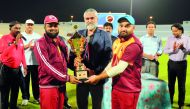 Qatar captain Inamul Haq (left) and vice captain Taimoor (right) pose with the trophy along with Singapore Cricket CEO Saad Janjuwa in Doha yesterday. 