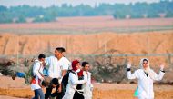 A wounded protester is evacuated during a demonstration near the border between Israel and Khan Yunis in the southern Gaza Strip on November 9, 2018. AFP / Said Khatib

